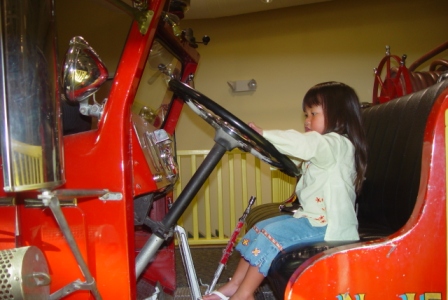 Kasen driving the fire engine at the Discovery Center